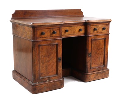 Lot 395 - A Victorian walnut breakfront pedestal desk