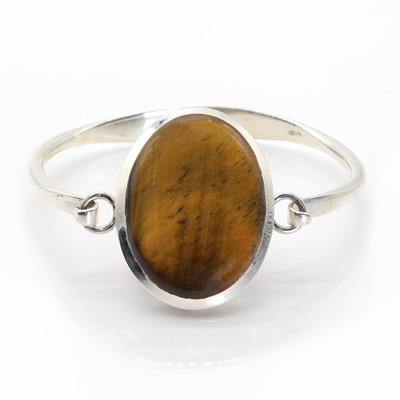 Lot 1189 - A silver tiger's eye bangle