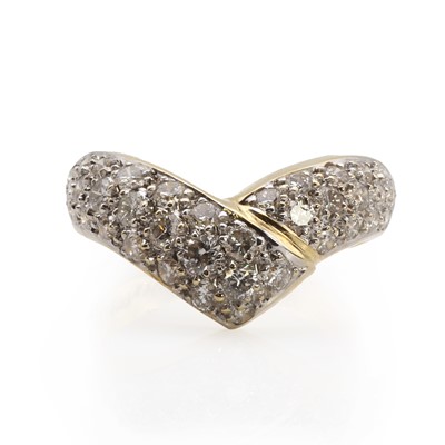 Lot 1059 - A gold diamond set wishbone ring