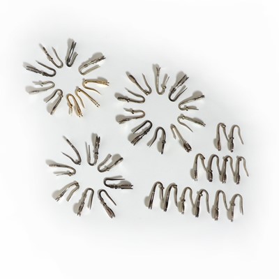 Lot 1408 - A collection of gold and silver napkin clips