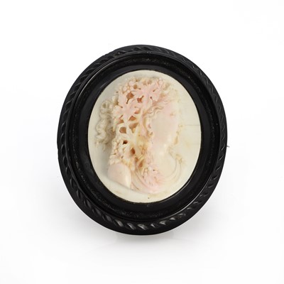 Lot 1008 - A Victorian jet and shell cameo brooch
