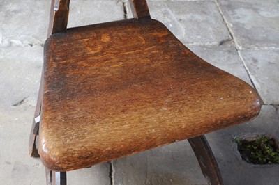 Lot 23 - A 'Granville' oak chair designed by E W Pugin