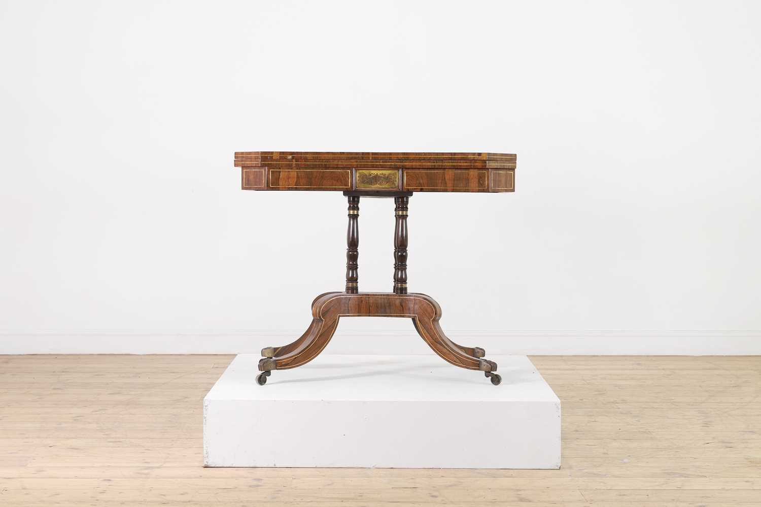 Lot 280 - A Regency rosewood and brass card table