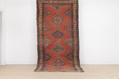 Lot 561 - A tribal wool rug