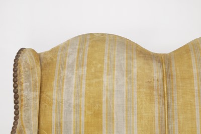 Lot 87 - A pair of Louis XV walnut sofas