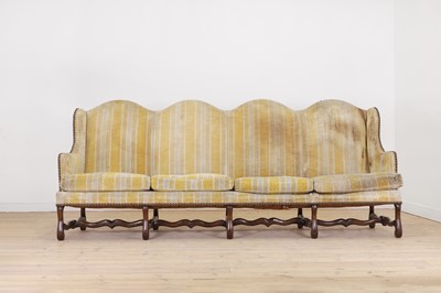 Lot 87 - A pair of Louis XV walnut sofas