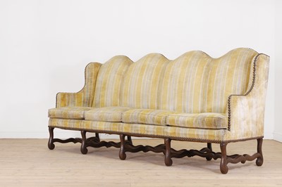 Lot 87 - A pair of Louis XV walnut sofas