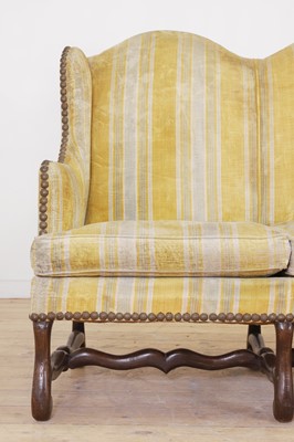 Lot 87 - A pair of Louis XV walnut sofas