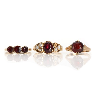 Lot 1285 - Three gold garnet set rings