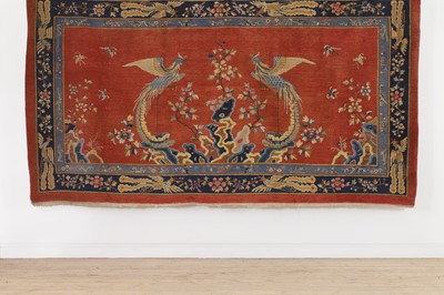 Lot 392 - A wool rug