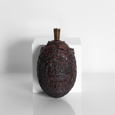 Lot 2 - A carved coconut 'bugbear' flask
