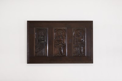 Lot 353 - Three carved oak panels depicting saints