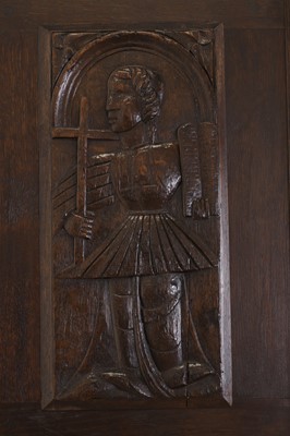 Lot 353 - Three carved oak panels depicting saints