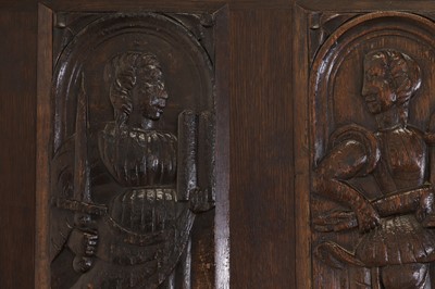 Lot 353 - Three carved oak panels depicting saints