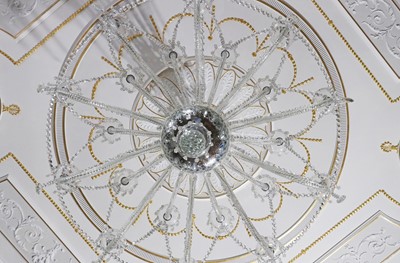 Lot 493 - A cut and moulded crystal glass twenty-light chandelier in the manner of Baccarat