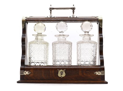 Lot 208 - An oak tantalus