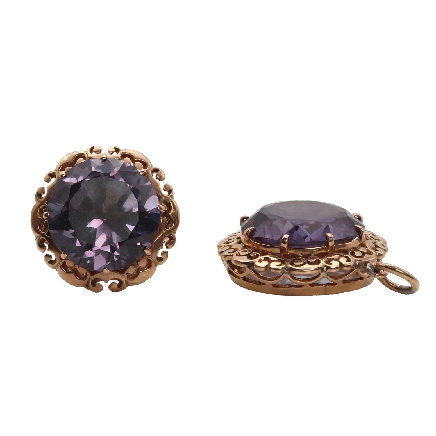 Lot 1168 - A rose gold synthetic colour change sapphire ring and pendants set