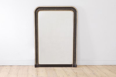 Lot 617 - An ebonised and parcel-gilt overmantel mirror