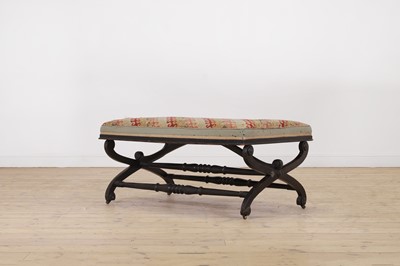Lot 38 - An ebonised wooden stool