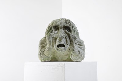 Lot 624 - A carved medieval-style stone head