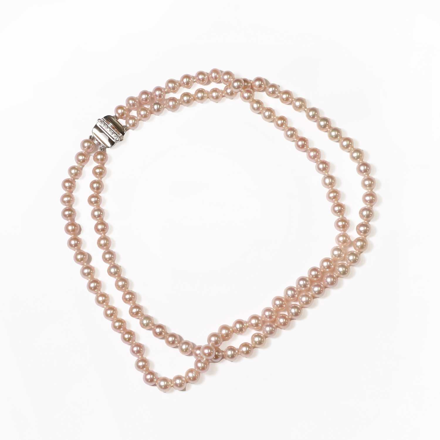 Lot 1213 - A uniform two row pink freshwater pearl necklace