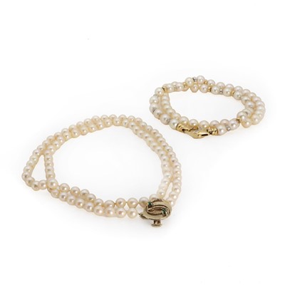 Lot 1328 - Two single row uniform cultured pearl necklaces