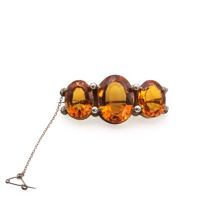 Lot 1005 - A Victorian silver gilt citrine three stone brooch