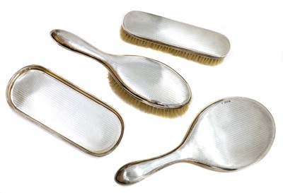 Lot 13 - A four piece silver dressing table set