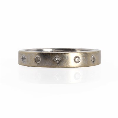 Lot 1106 - An 18ct white gold five stone diamond band ring