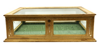 Lot 183 - A tooled leather tabletop display cabinet