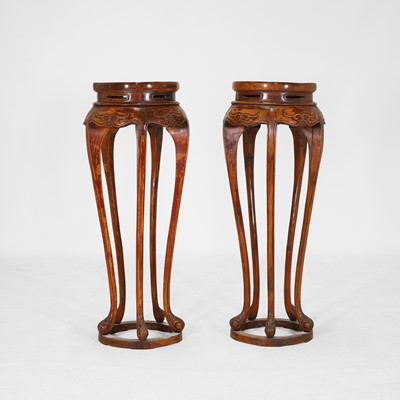 Lot 383 - A pair of hardwood jardinière stands
