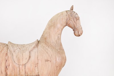 Lot 61 - A stripped teak pull-along horse