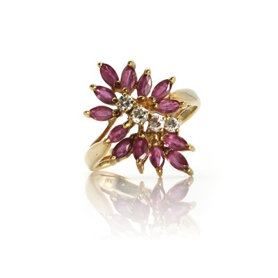 Lot 1130 - An asymmetric ruby and diamond cluster ring