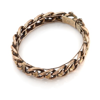 Lot 1263 - A Victorian chain and ivy leaf hinged bangle