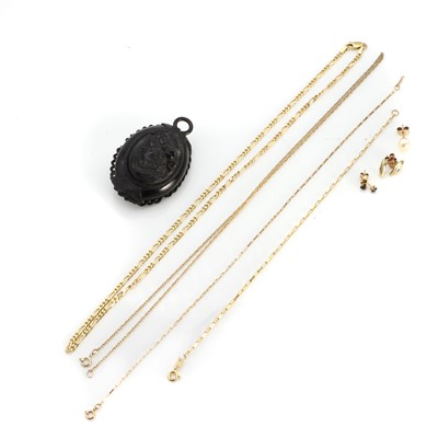 Lot 1333 - A carved jet pendant and a small collection of gold jewellery