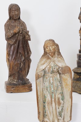 Lot 93 - A group of carved wood saints and architectural fragments