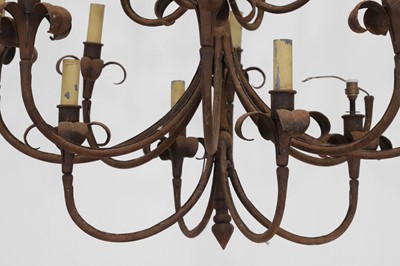 Lot 450 - A wrought-metal sixteen-light chandelier