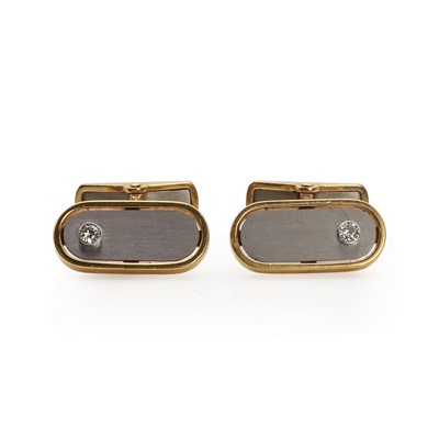 Lot 1391 - A pair of two colour gold diamond cufflinks