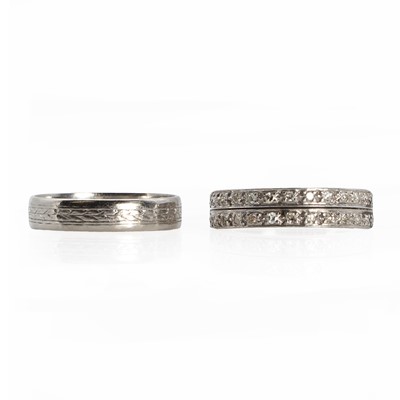 Lot 1251 - A white gold diamond half eternity ring and a platinum wedding ring