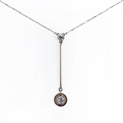 Lot 1026 - A gold Edna May style diamond drop necklace