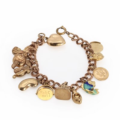 Lot 1418 - A gold charm bracelet