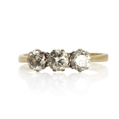 Lot 1067 - An 18ct gold diamond three stone ring