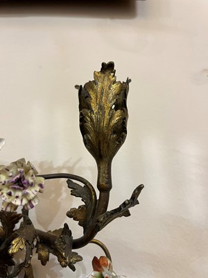 Lot 209 - A pair of Louis XV-style ormolu and porcelain wall lights