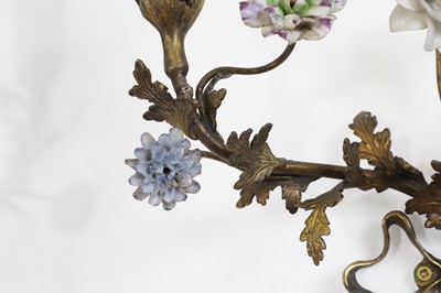 Lot 209 - A pair of Louis XV-style ormolu and porcelain wall lights