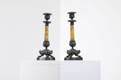 Lot 96 - A pair of Empire bronze and Siena marble candlesticks