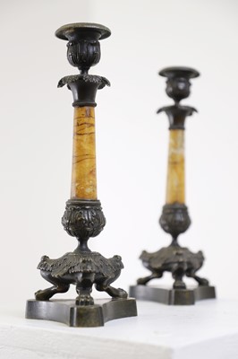Lot 96 - A pair of Empire bronze and Siena marble candlesticks