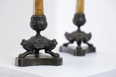 Lot 96 - A pair of Empire bronze and Siena marble candlesticks