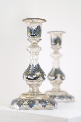 Lot 323 - A pair of enamel and parcel-gilt glass candlesticks