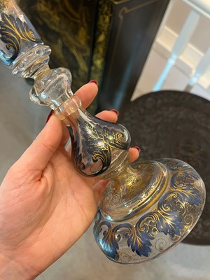 Lot 323 - A pair of enamel and parcel-gilt glass candlesticks