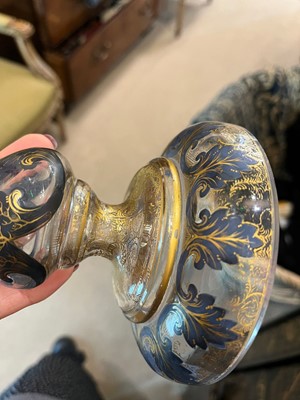 Lot 323 - A pair of enamel and parcel-gilt glass candlesticks